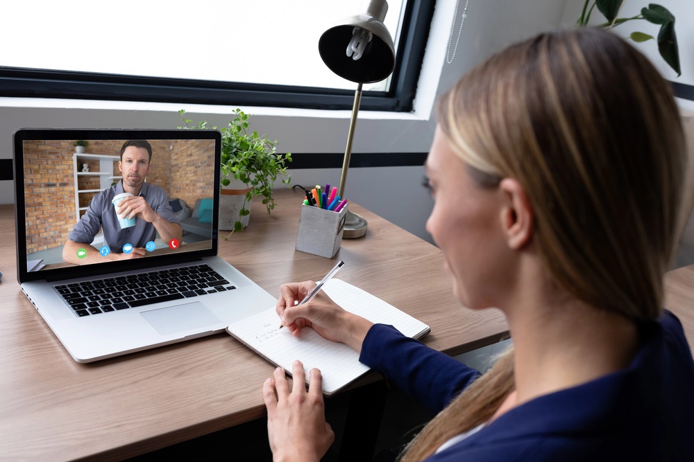 long-distance couple in a video call discussing plans about the progress of their relationship
