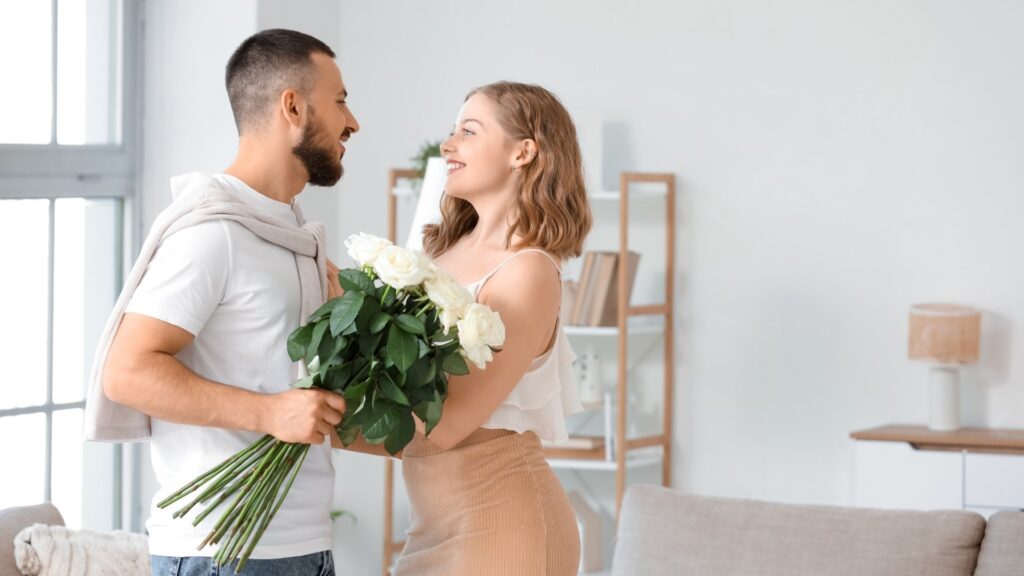 man giving girlfriend a flower gift