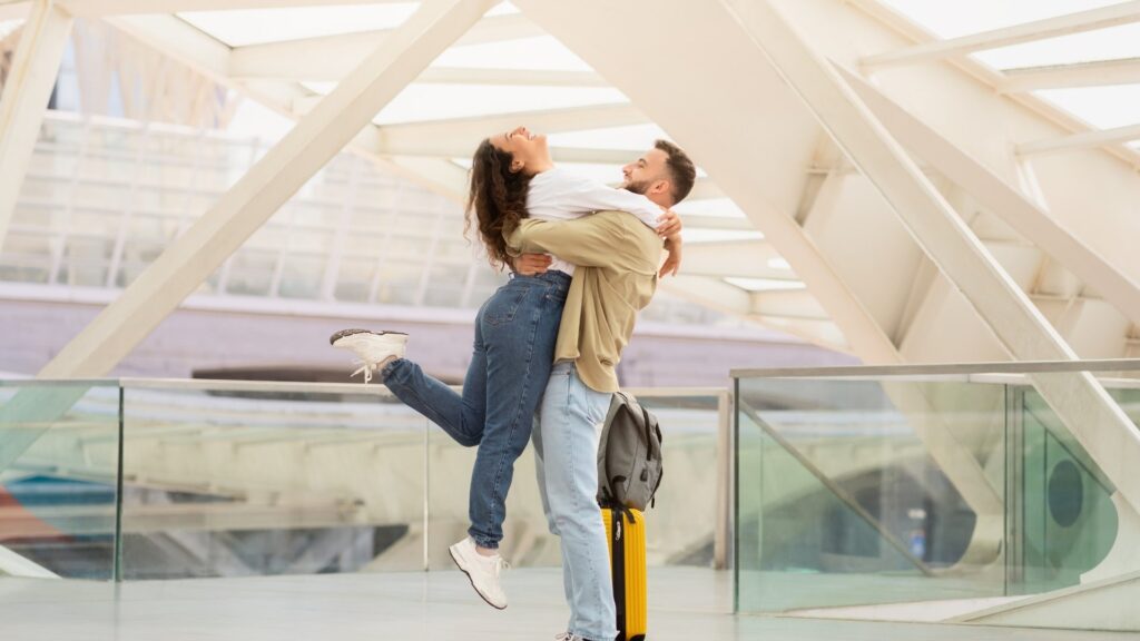 man swinging his lady around in a romantic way