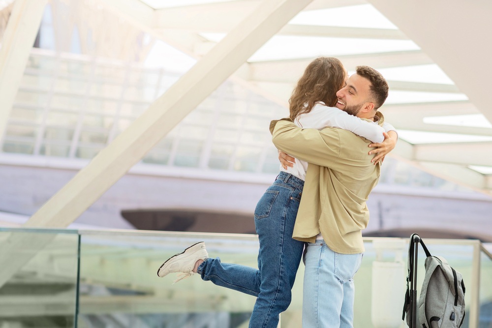 happy long-distance couple in a warm hug after reuniting