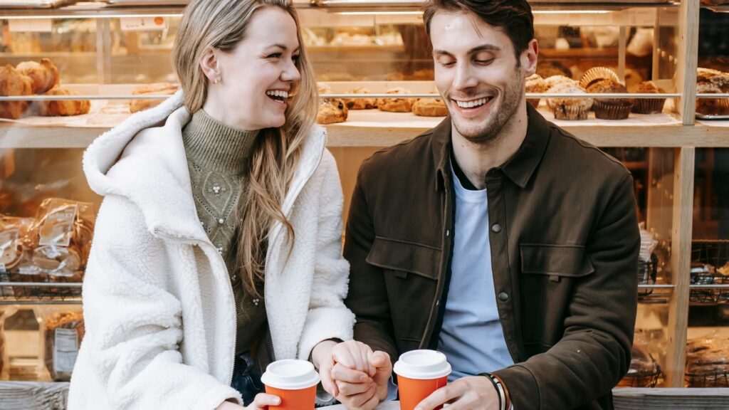 couple smiling as they solve a hard riddle