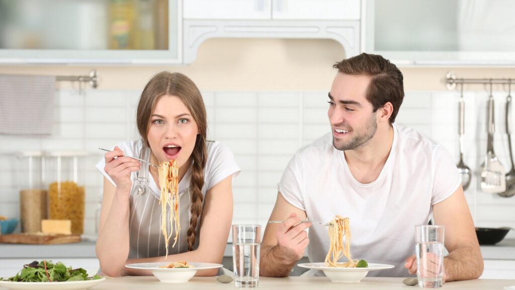 long distance couple eating pasta during dinner