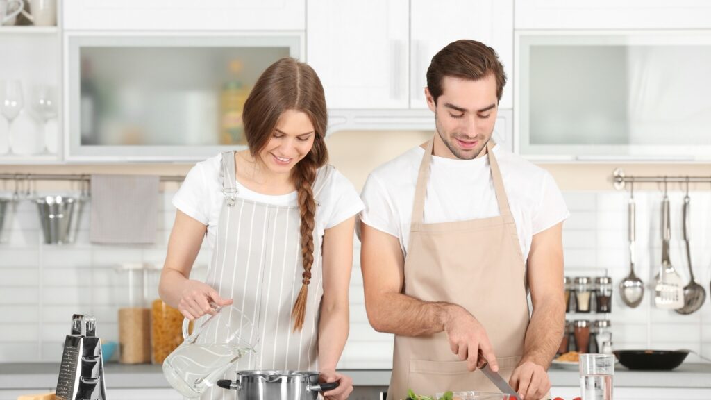 couple baking together in the kitchen