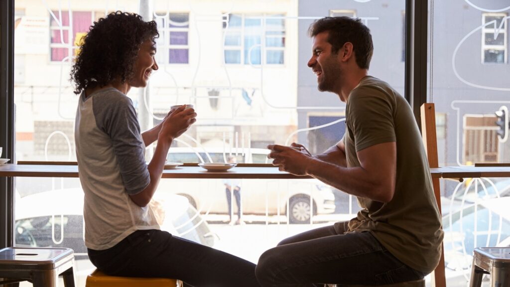 couple having their dinner while they watch the sun, set