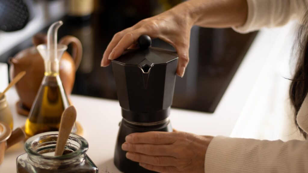 man handling his new coffee maker which was gotten for him by his long-distance girlfriend