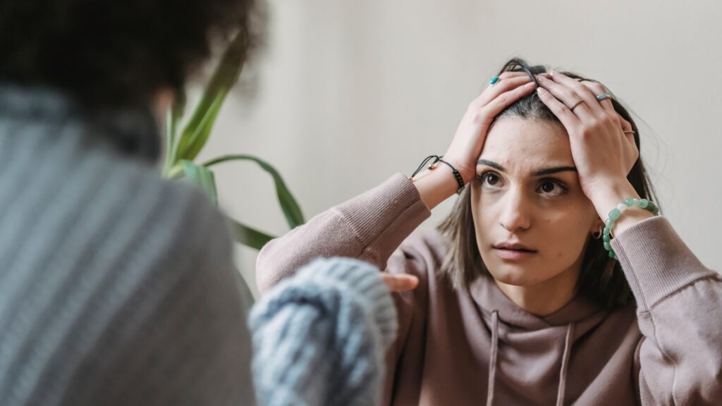 lady feeling bad because she is sad and her long-distance partner cannot do anything about it