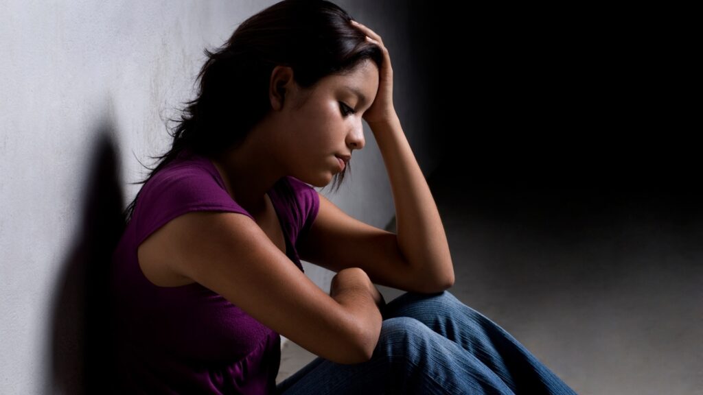 lady feeling sad after watching social media highlights of some relationships