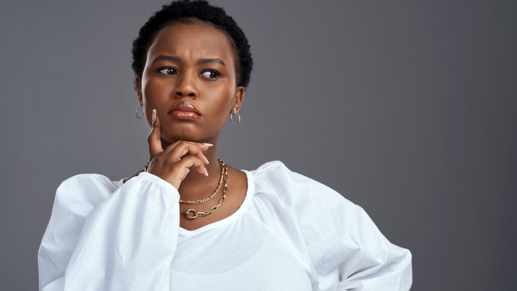 lady disturbed as she thinks about questions to start a conversation with her long distance partner