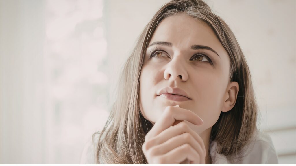 woman looking up lost in deep thought over the future of her long distance relationship