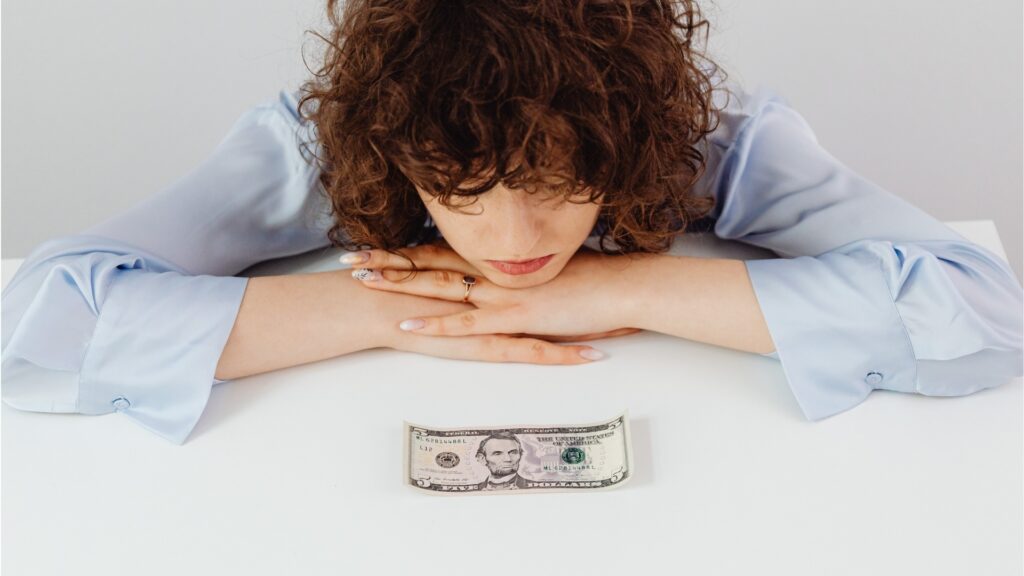 lady feeling stressed over her previous financial decisions