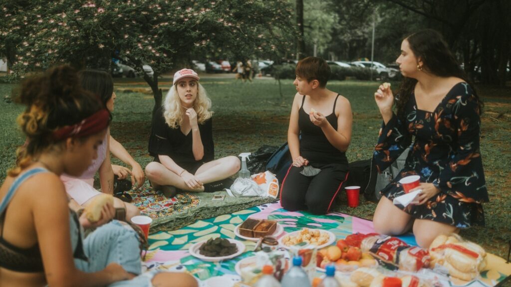 lady on a picnic date with fellow ladies