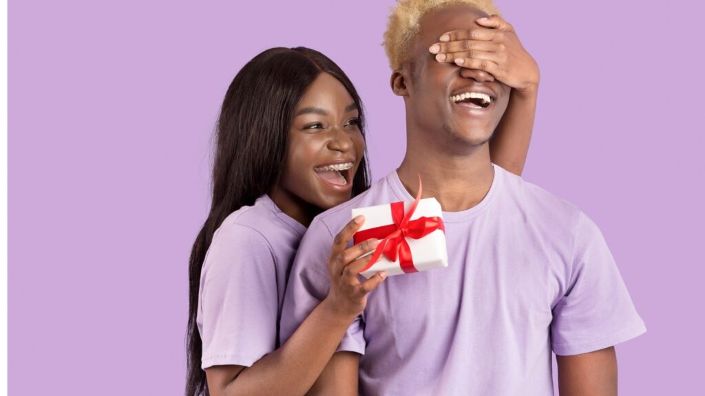 lady gifting her long-distance partner a small box of necklace