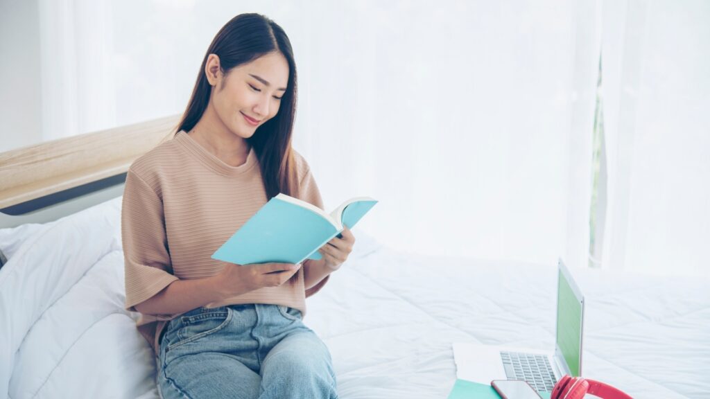 lady going through a personalised recipe book gotten for her by her long-distance partner
