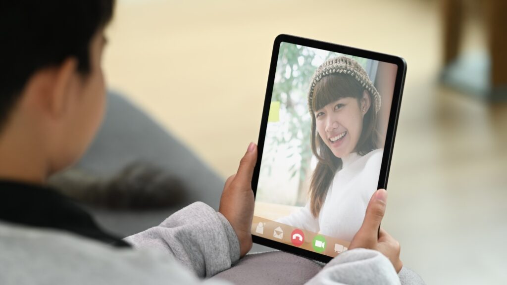 couple on zoom call showing each other around
