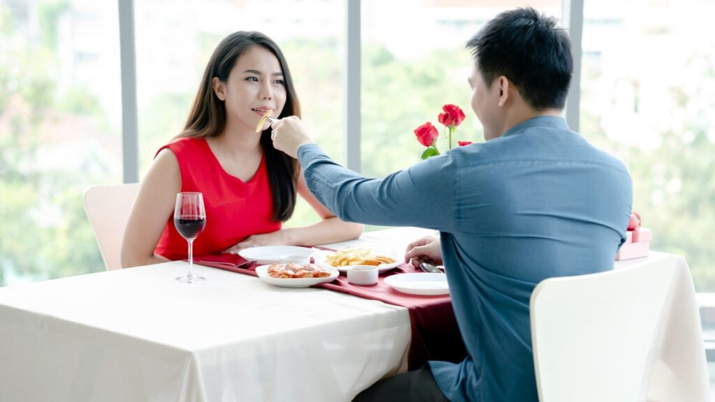 man making romantic gestures towards woman