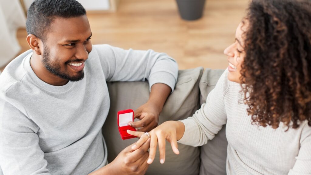 lady receiving a ring-dish from her long distance partner