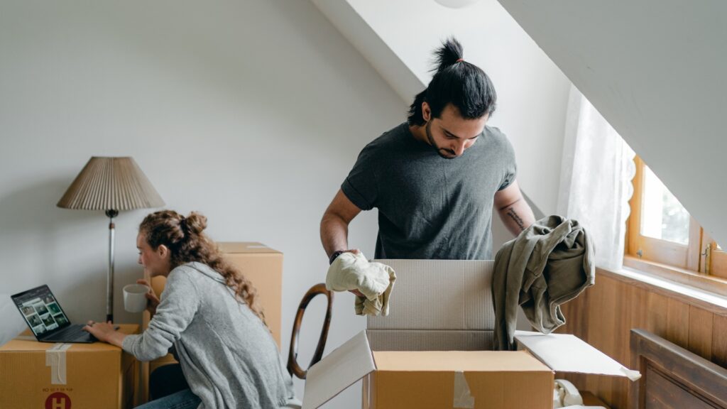 man doing some chores while his long-distance partner is busy with another task