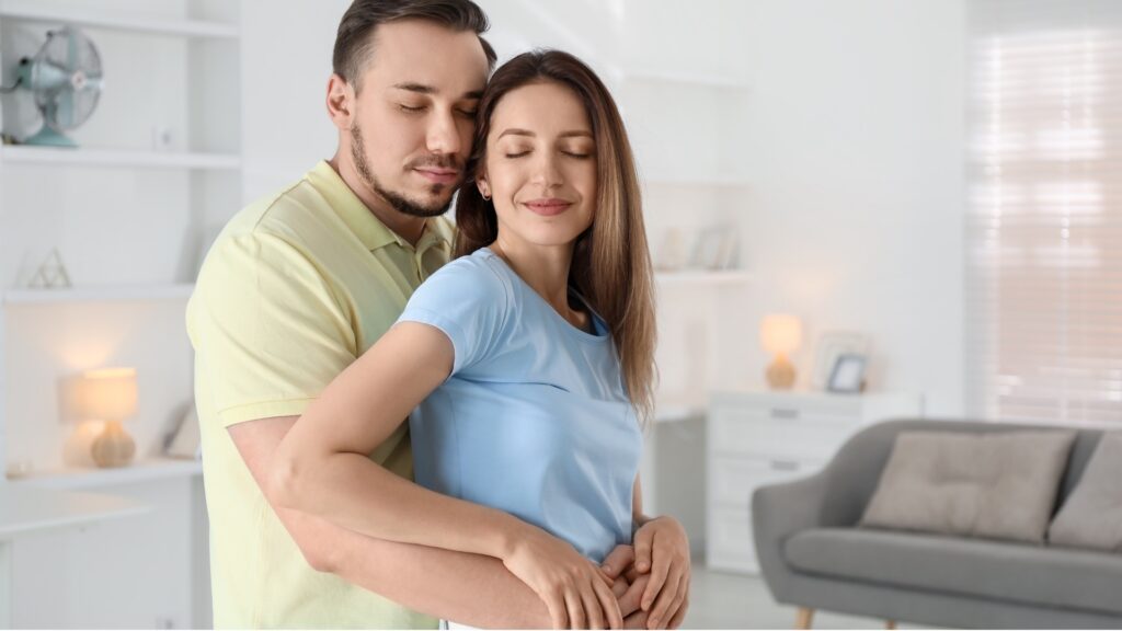 couple in a warm embrace after being apart for a long while
