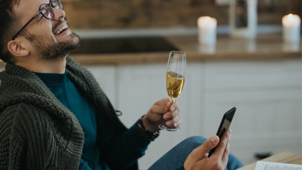 man having a good laugh during his conversation with his long distance girlfriend