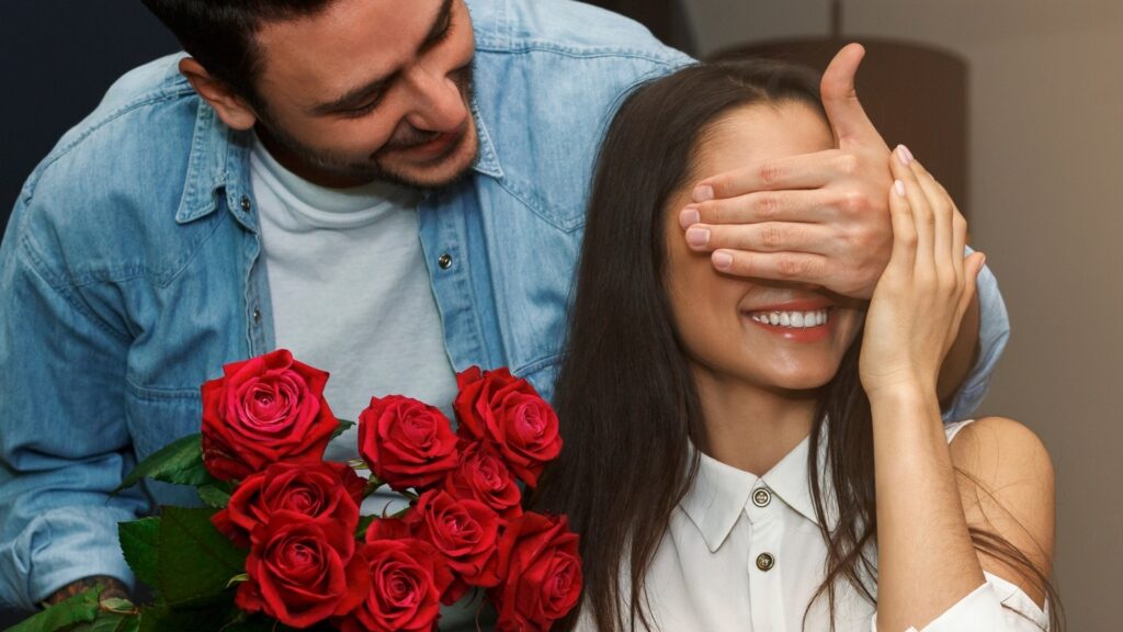 man gifting his long-distance partner a birth flower
