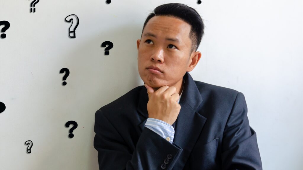 man thinking of intelligent questions to ask
