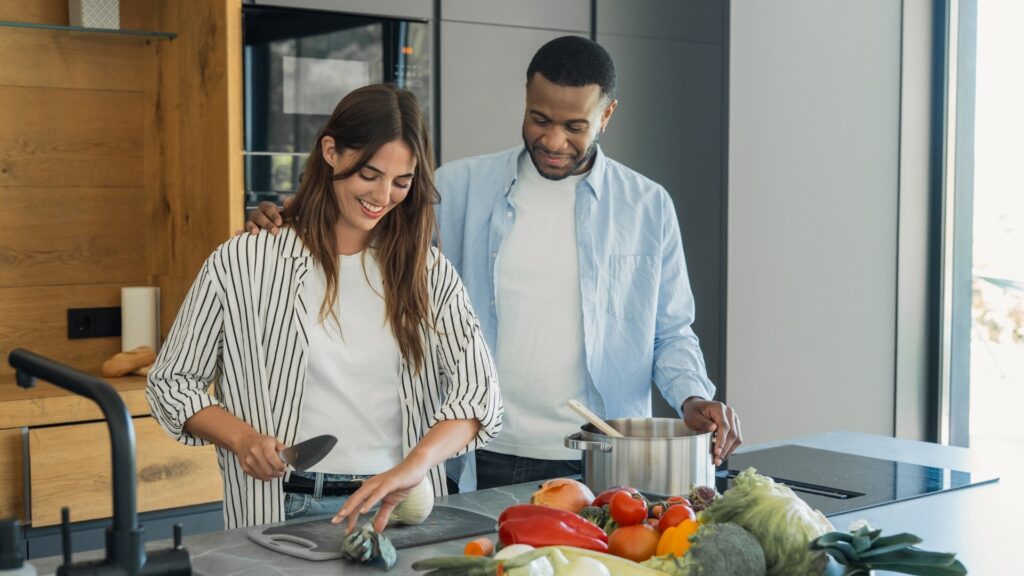 couple cooking dinner after one of them had made the selection
