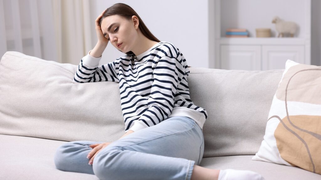 lady feeling sad after recalling what her long-distance partner did 