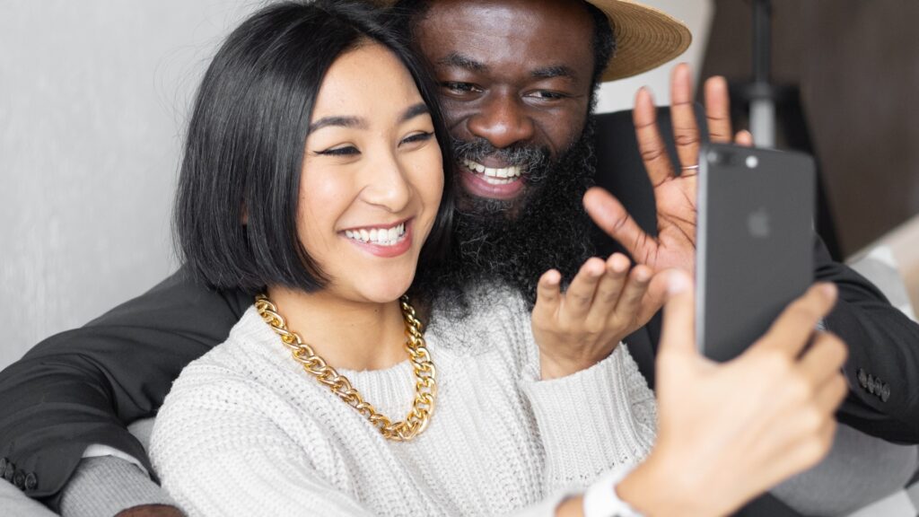 couple in close proximity smiling at each other