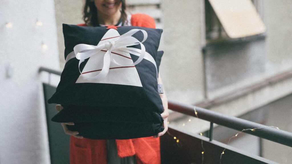 lady who just received her throw pillow from her long distance boyfriend
