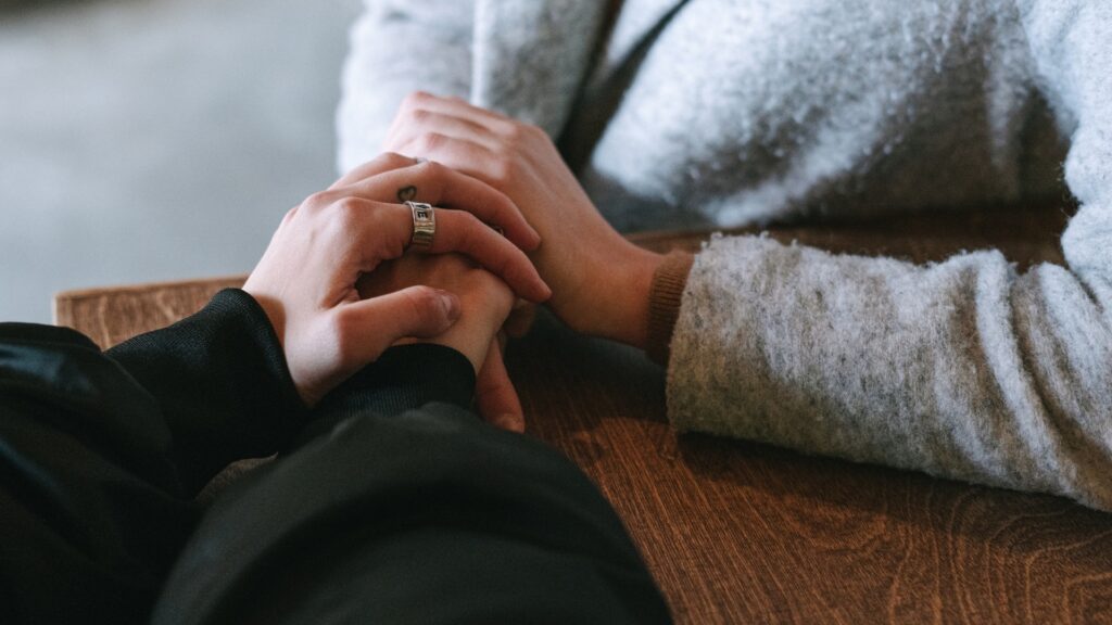 couple holding each other in prayer