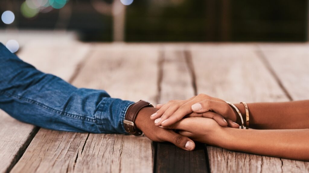 hands holding each other reassuringly