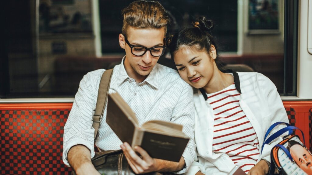 couple feeling nostalgic while reading a book
