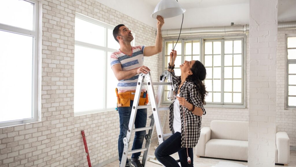 couple painting their new home