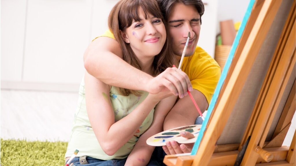 couple trying out a virtual drawing in a physical slate
