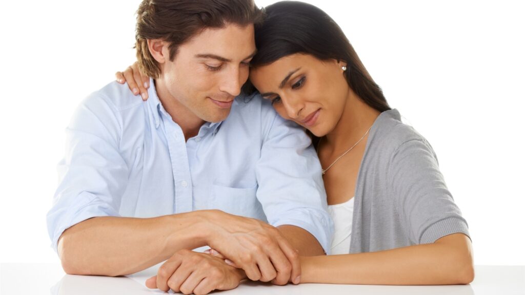 man and woman leaning into each other for support
