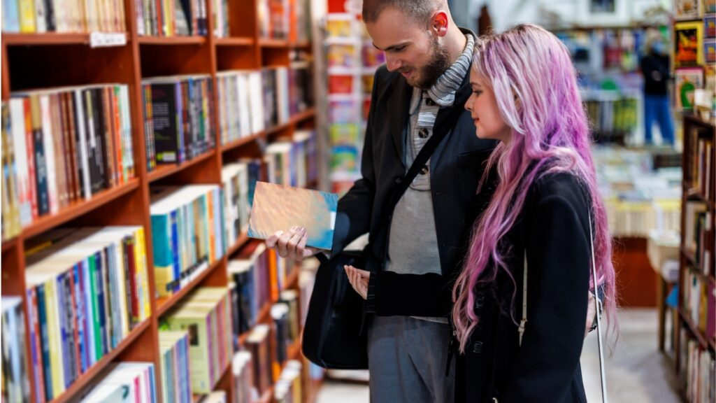 couple in a bookstore making their choices of books