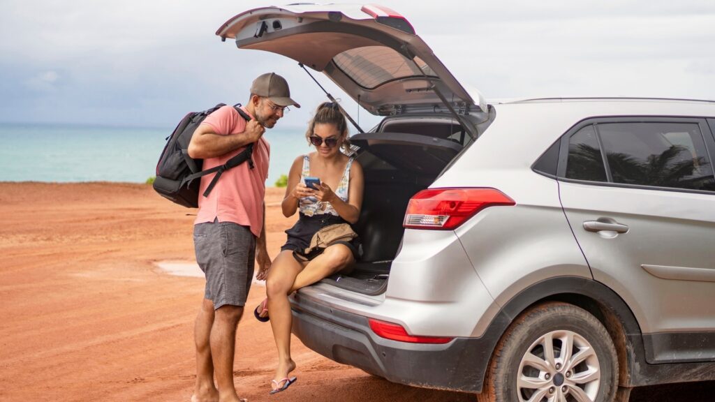couple driving on road trip