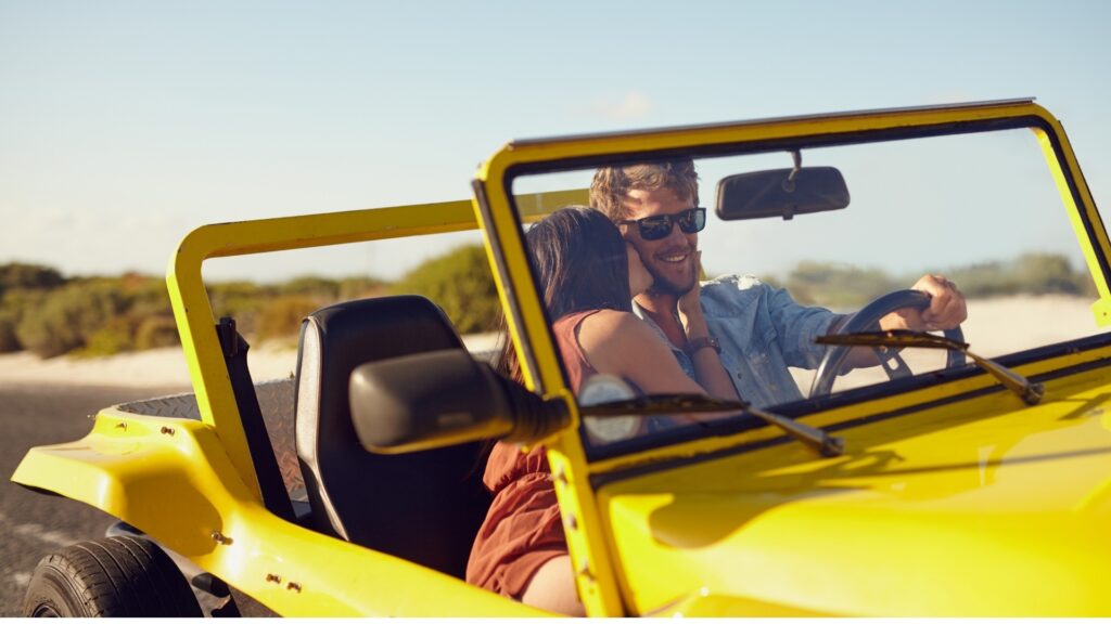 man and woman on a road trip