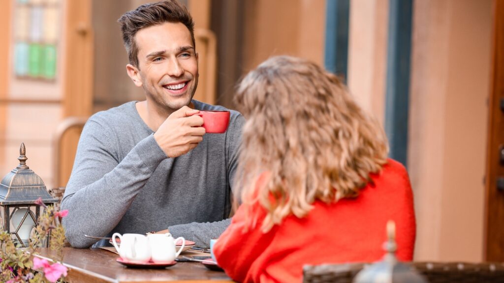couple sharing coffee during a book date
