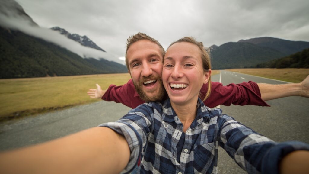 man and woman on a road trip