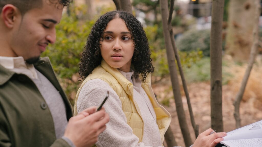 lady jealous as she sees her partner scrolling through instagram