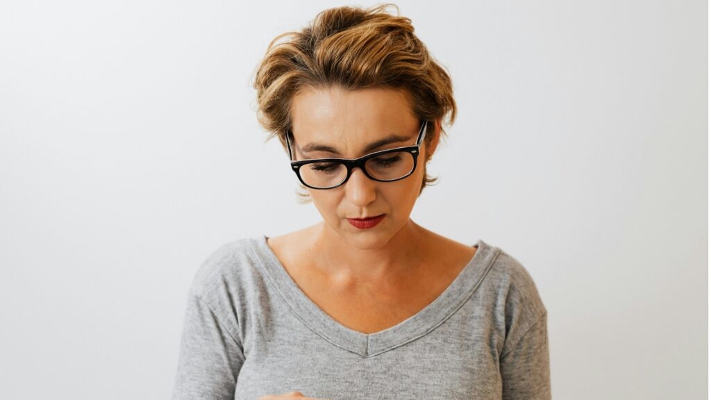 lady who is angry with her long-distance partner's recent dry texts but chooses to not talk about it
 
