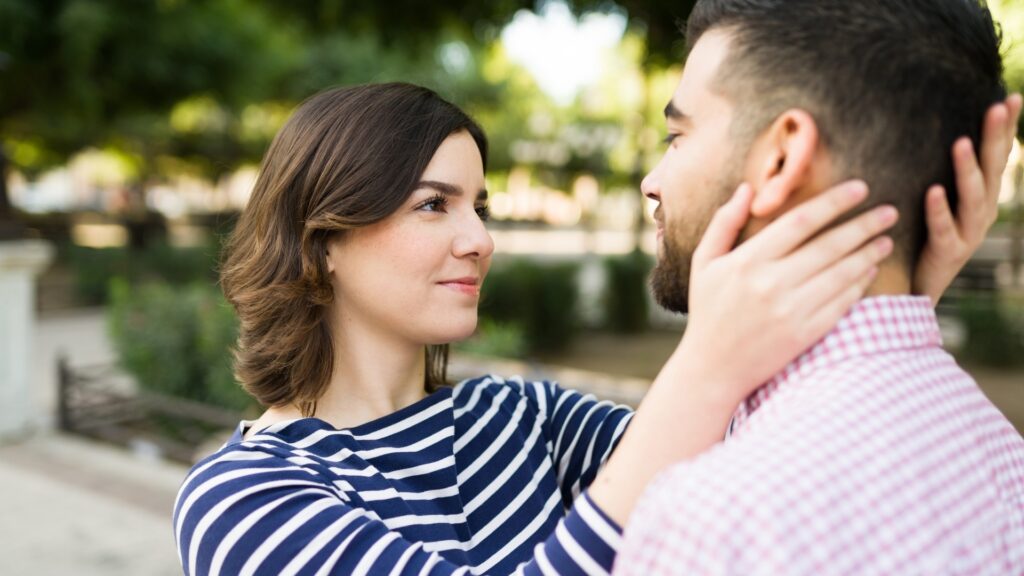 lady on stripe polo trying to give her boy friend a recent review of him