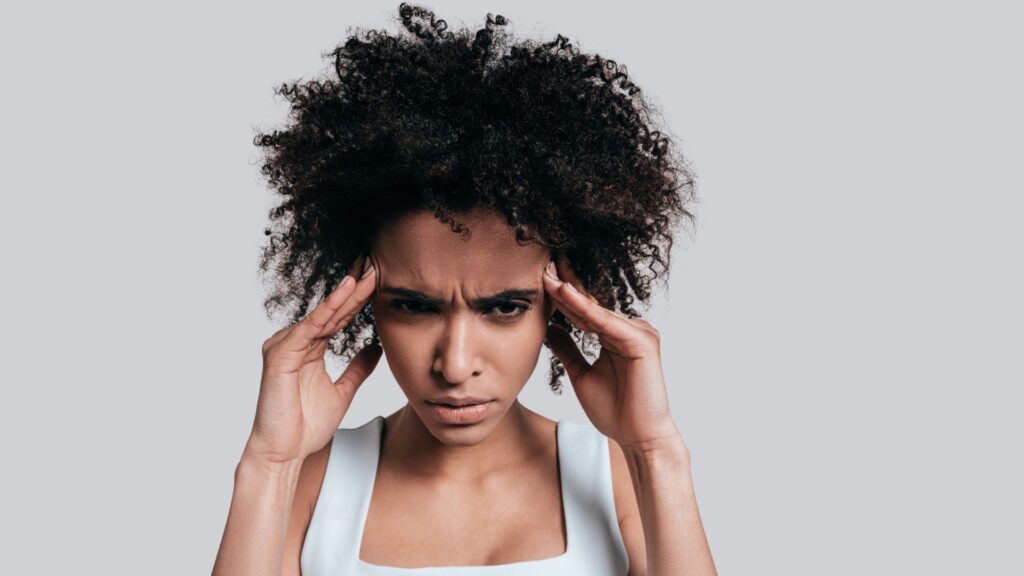 lady holding her head in frustration 