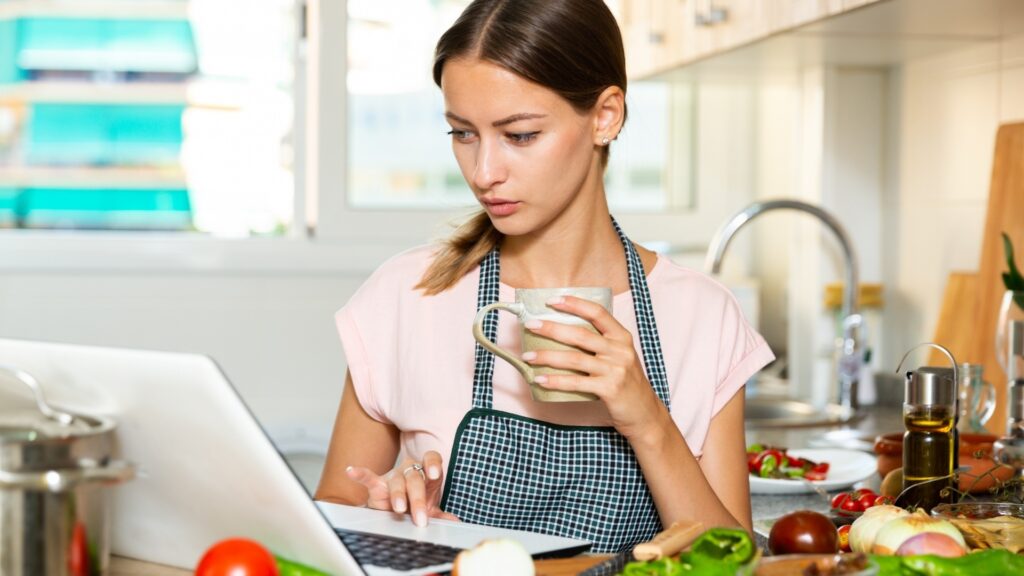 lady taking a drink during cooking