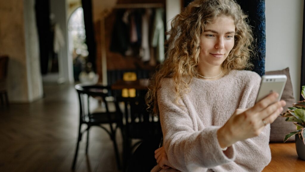 lady hiding a message  on her phone