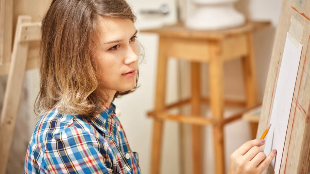 lady on check shirt painting her long distance partner's favorite snack