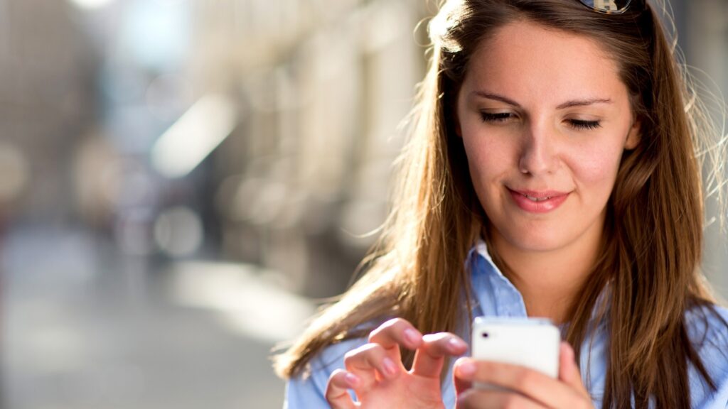 woman on sky blue shirt rereading a text in order to understand better