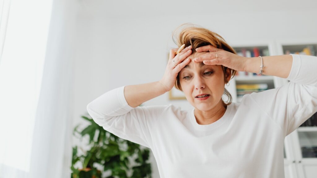 woman on white long-sleeve being defensive of her attitude