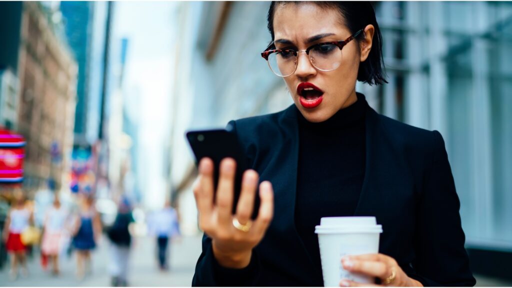 lady shocked as she read a text concerning sensitive informations she had shared with her partner in time past